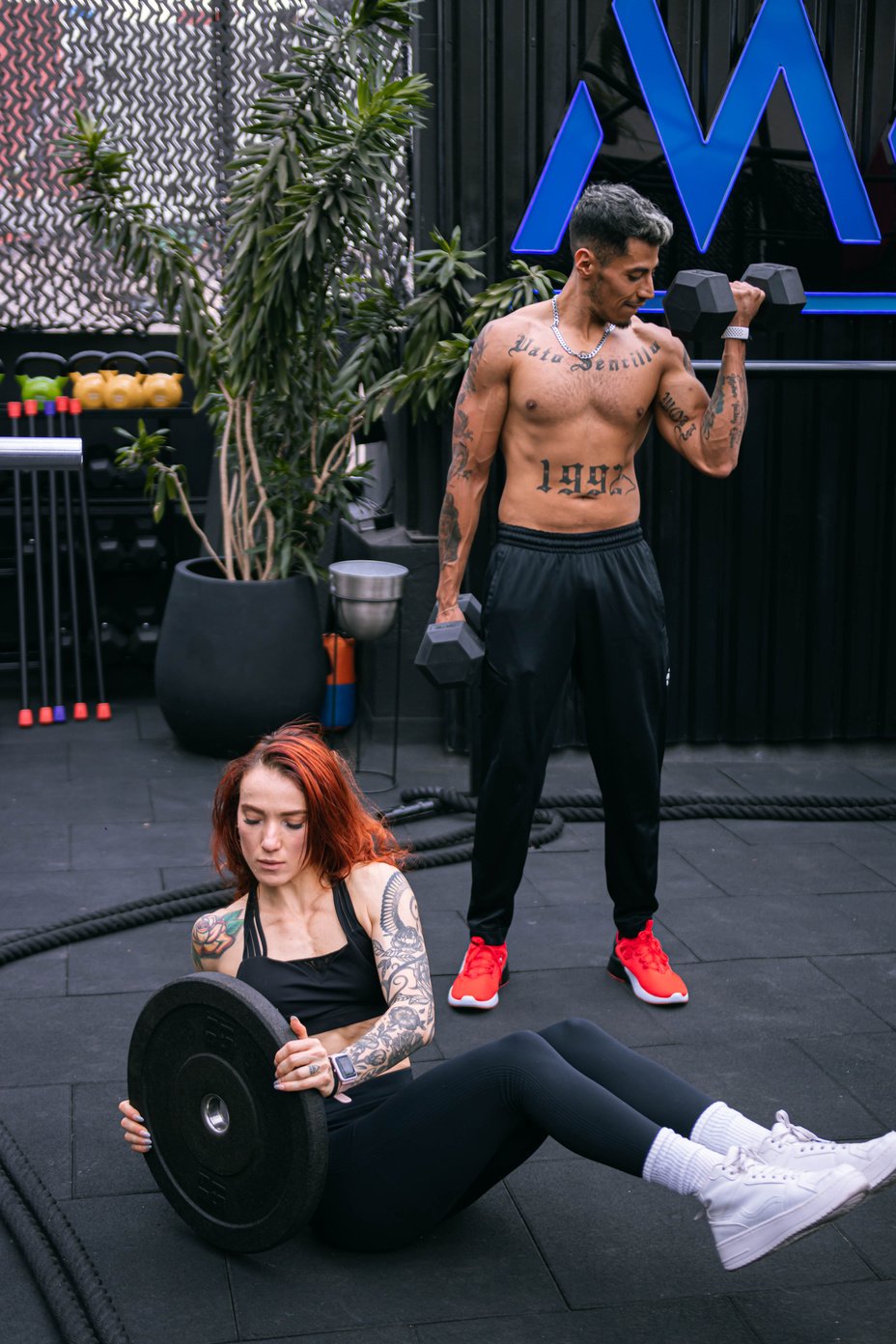 Man and Woman Exercising Together